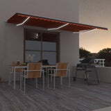 Manual Retractable Awning with LED 600x300 cm Orange and Brown 3068965